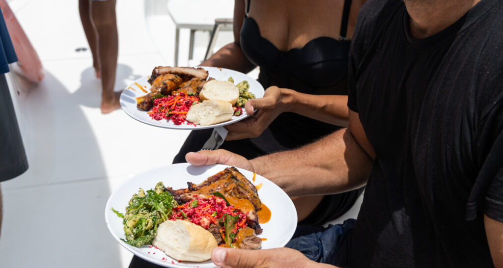 Freshly grilled chicken and fish being prepared for lunch aboard a boat trip from Manavgat to the Mediterranean coast near Side