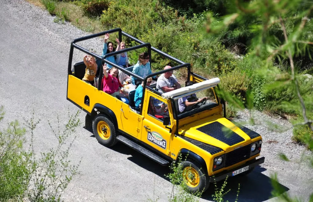 Family with children smiling on a safe, guided Jeep Safari excursion from Side