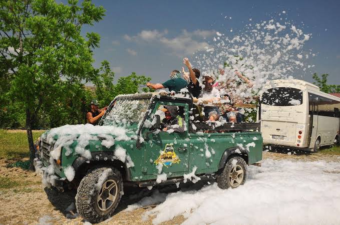 Fun foam party stop during a Side Jeep Safari tour for cooling down and photos