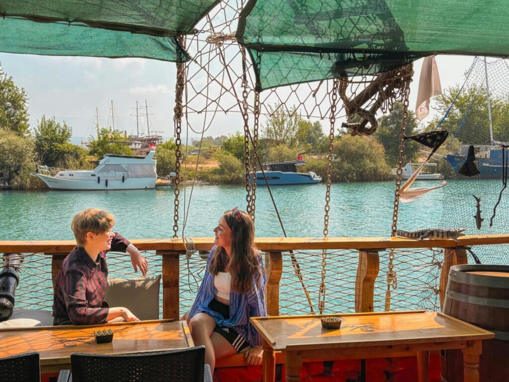 Family with children on pirate-themed boat cruising Manavgat River