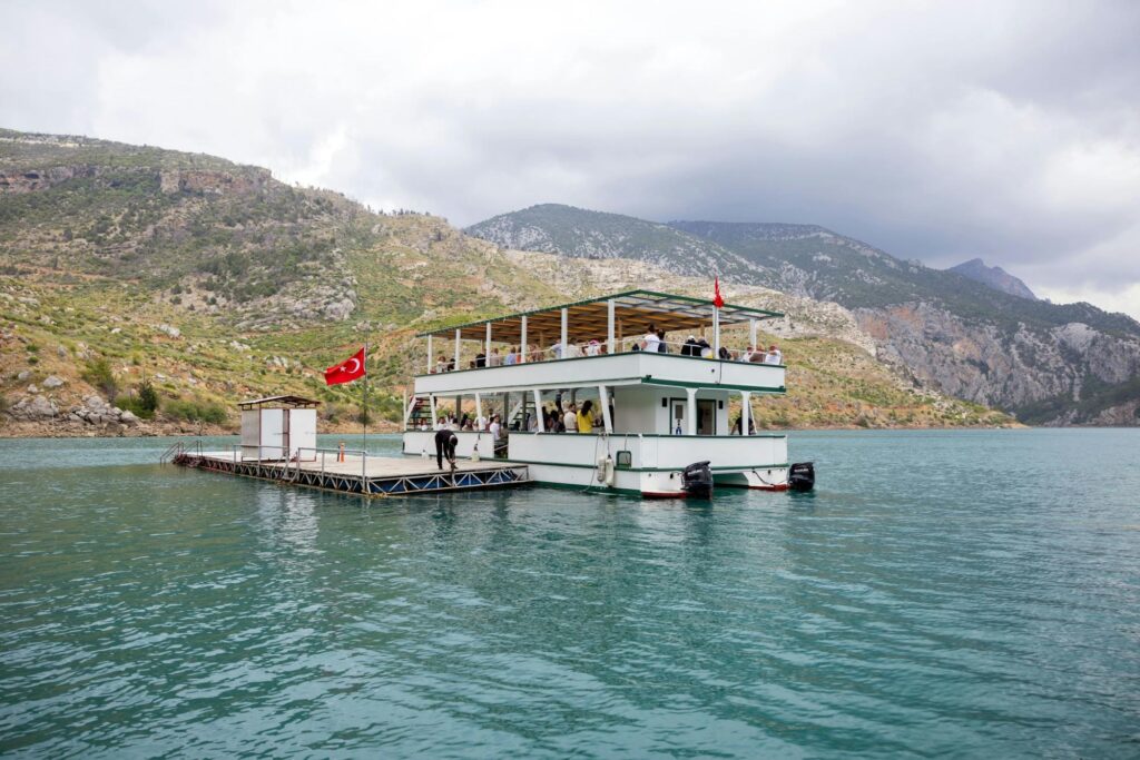 Traditional Turkish lunch at lakeside restaurant included in Side Mix Tour with grilled chicken and local specialties