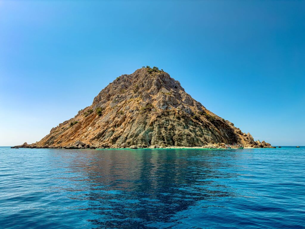 Crystal clear turquoise water and white sand beaches at Suluada Island swim stop