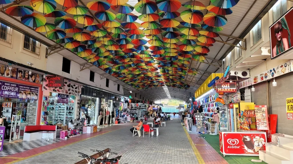 Colorful Turkish lamps, spices, and souvenirs displayed at the central bazaar market in Alanya