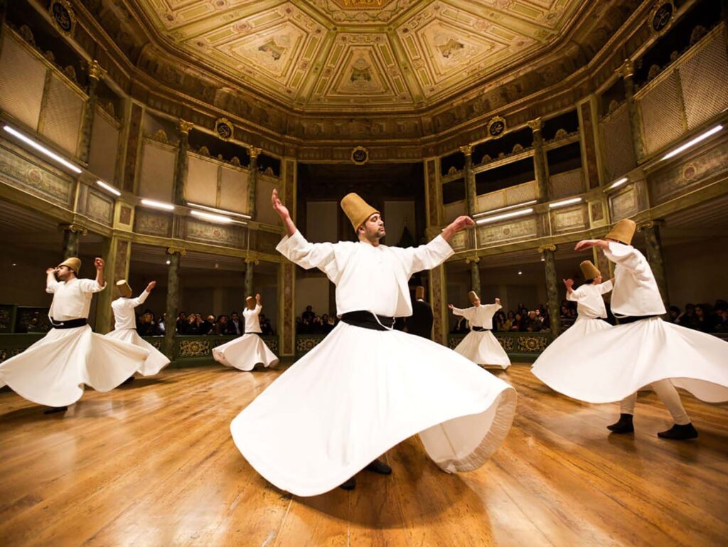 Fire of Anatolia dancers performing a Semah and dervish-inspired Anatolian dance sequence at Gloria Aspendos Arena near Side, Turkey