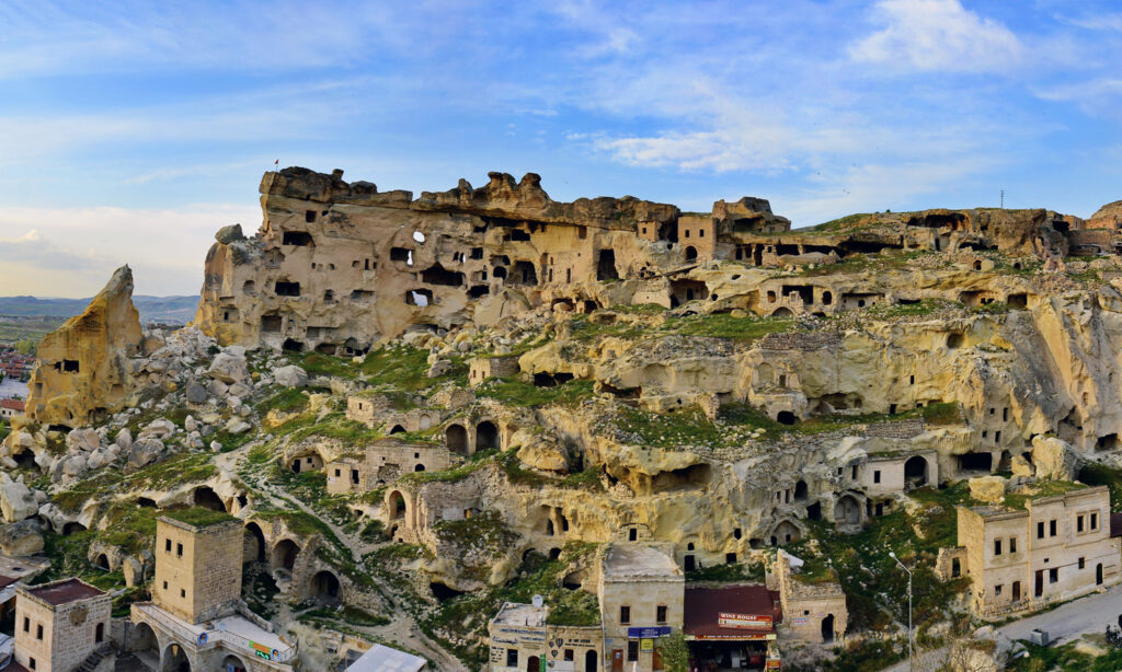 Traditional Cappadocia cave hotel with stone rooms and terrace in Göreme Turkey