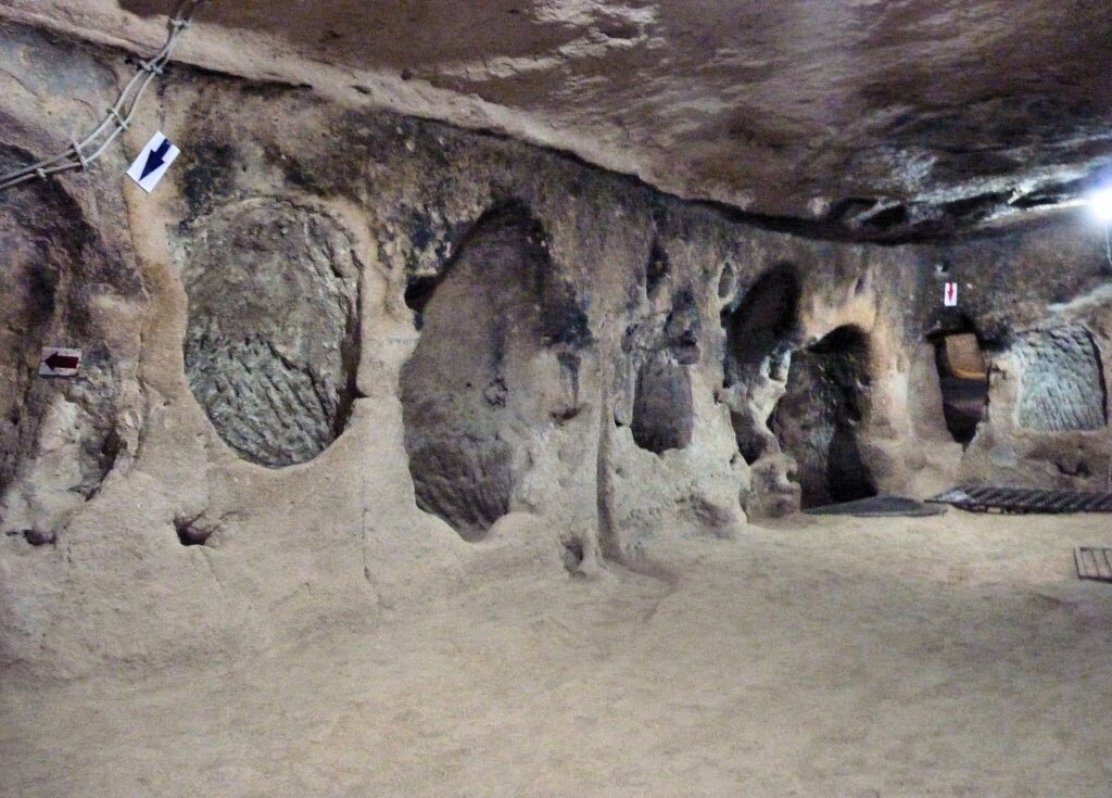 Ancient underground city tunnels and rooms inside Saratlı Underground City in Cappadocia Turkey