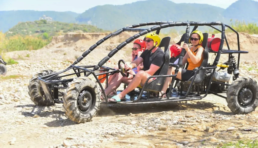 Happy family posing with their buggy after an afternoon 13:00 departure Side buggy tour in the Manavgat region.