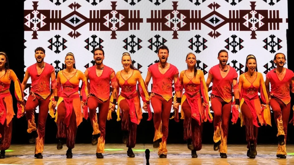 Fire of Anatolia (Anadolu Ateşi) dancers performing in colourful traditional Turkish costumes at Aspendos, combining Anatolian folk dance, ballet and modern choreography
