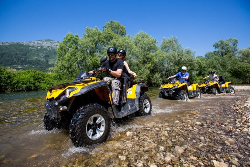 Quad safari convoy parked at scenic pine forest viewpoint overlooking Taurus Mountains near Side