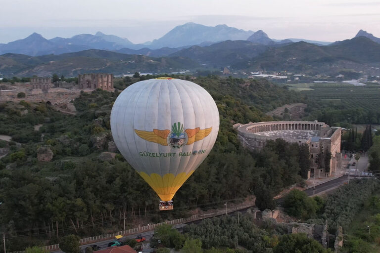 Hot air balloon inflating at sunrise for Side Aspendos flight with hotel transfer