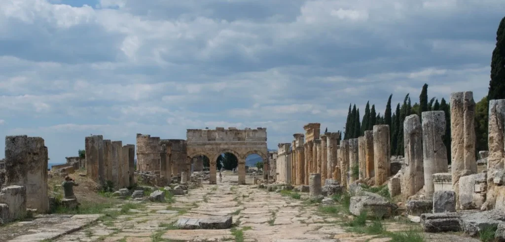 Roman columns and ancient stone arches along Frontinus Street in Hierapolis near Pamukkale
